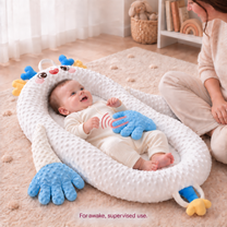 The second long finger of the soft blue patting hand highlighted with translucent red motion signals; awake baby supervised by an adult